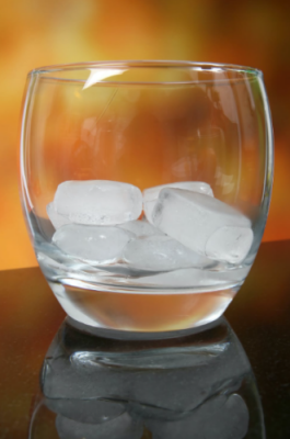 A glass with ice cubes.