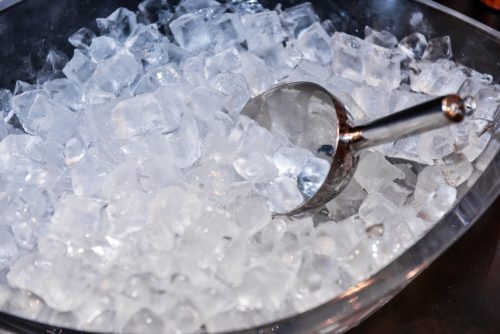 An image of ice cubes and a scoop in an ice machine