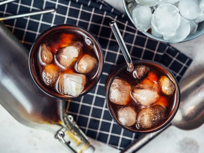 An image of ice cubes in glasses of cold-brew coffee