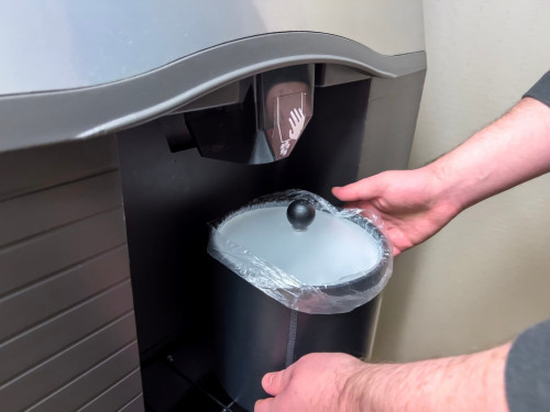 a person using an ice machine