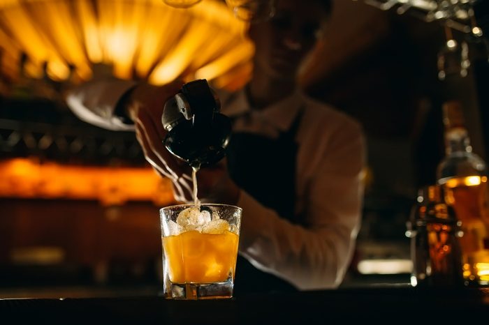 a bartender making a drink