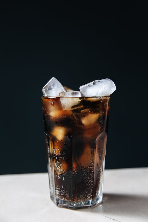 An image of ice cubes from an ice machine in a glass